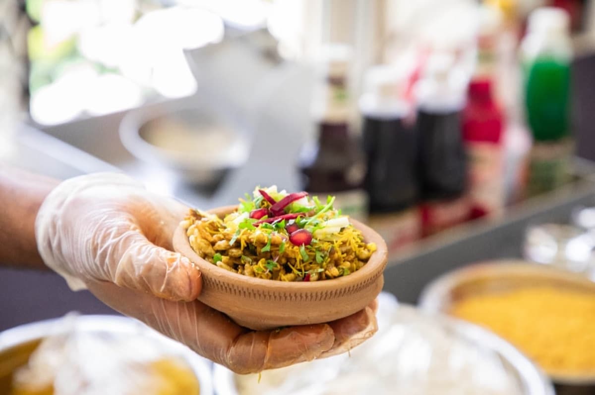 Papdi and sev puri chaat assembled fresh at a Cater Inc. live counter