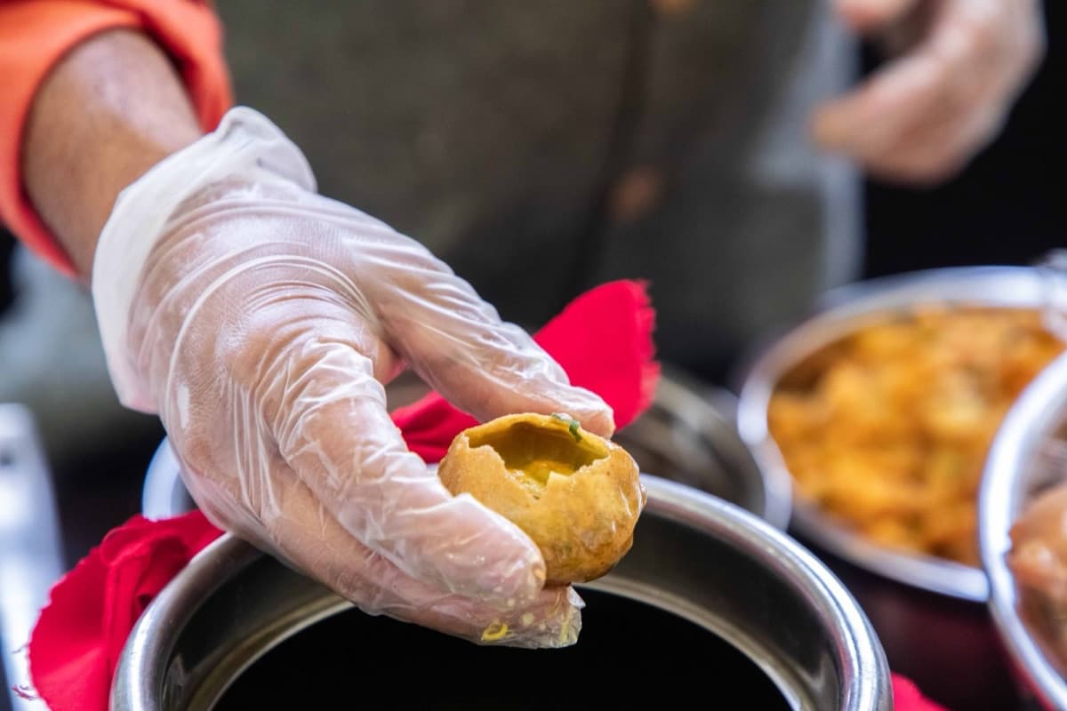 A live street-food counter cooking to order at a Cater Inc. event