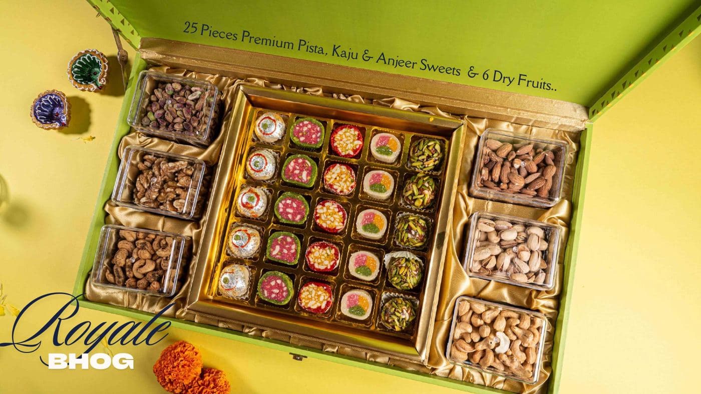 The Royale Bhog chest from Chhappan Bhog, mithai in the centre and jars of dry fruits either side